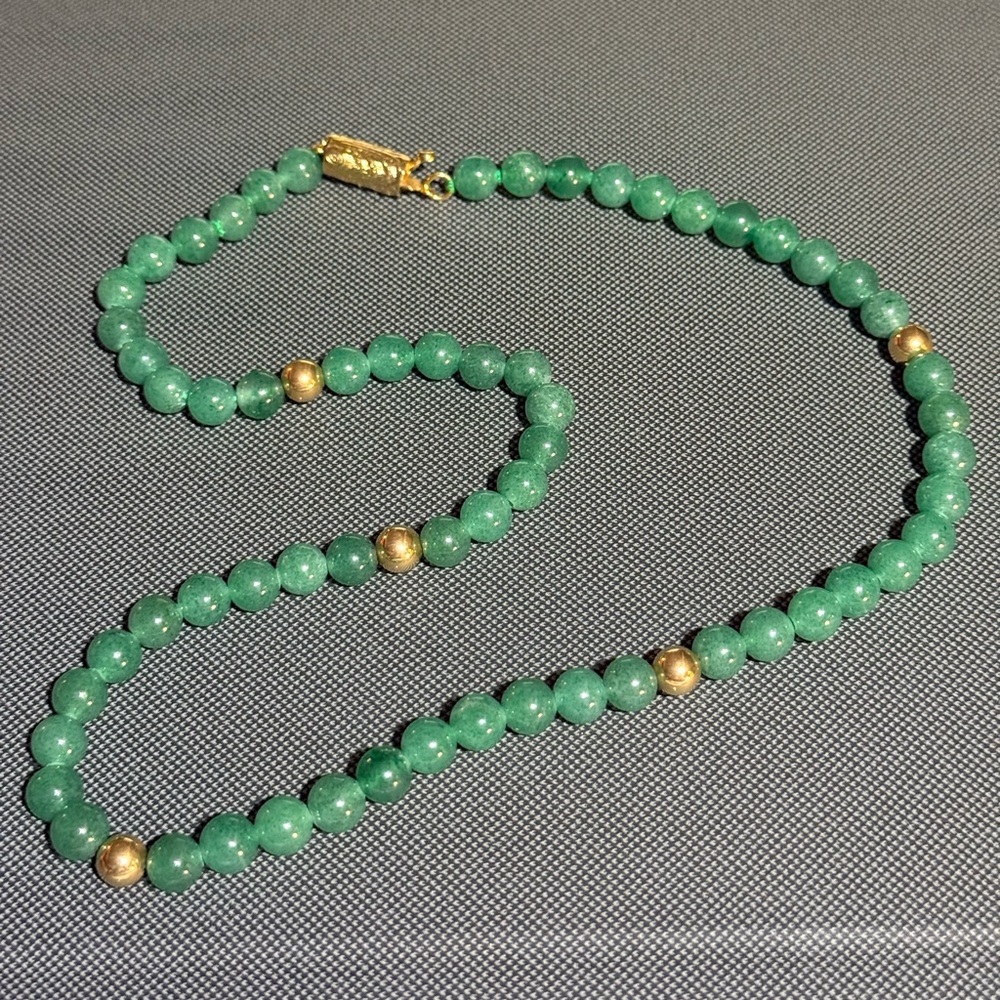 18 inch Jade beads with five 14k accent Beads